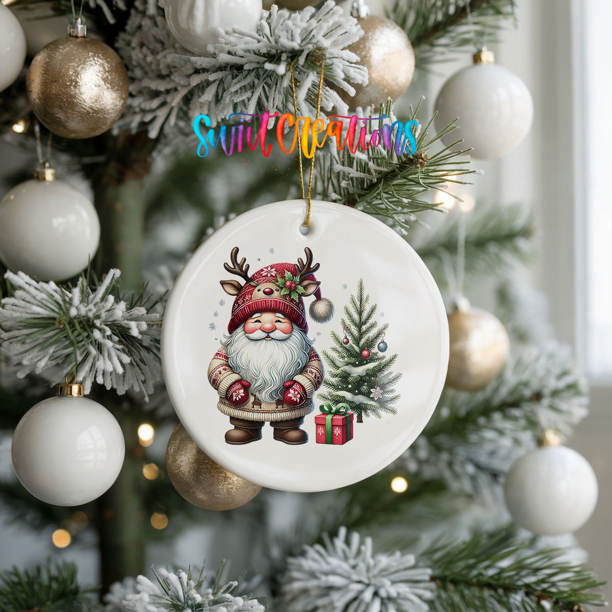 Santa beside a Christmas tree and wrapped gift ceramic Christmas ornament hanging on a frosted holiday tree