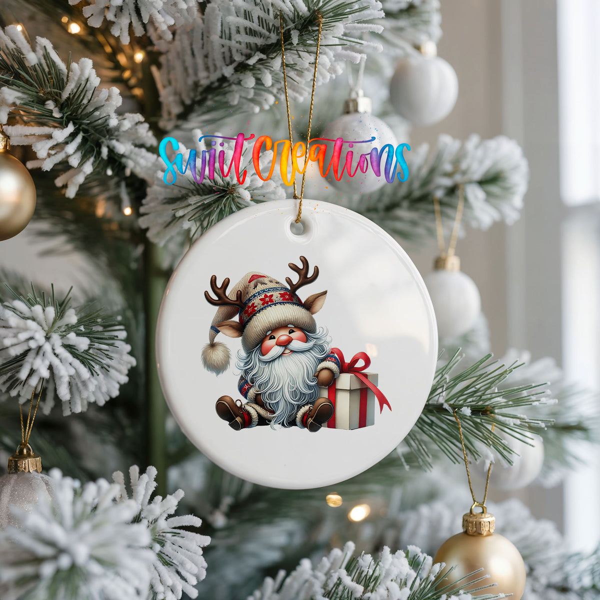 Santa sitting beside a wrapped Christmas gift ceramic Christmas ornament hanging on a frosted Christmas tree