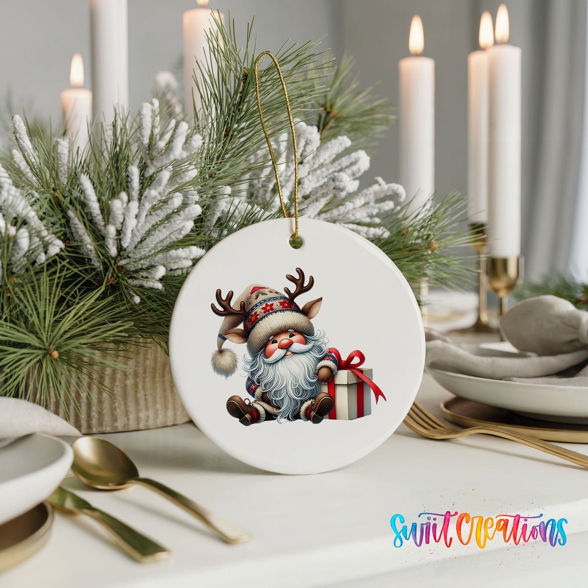 Santa sitting beside a wrapped Christmas gift ceramic Christmas ornament displayed with elegant holiday table decor