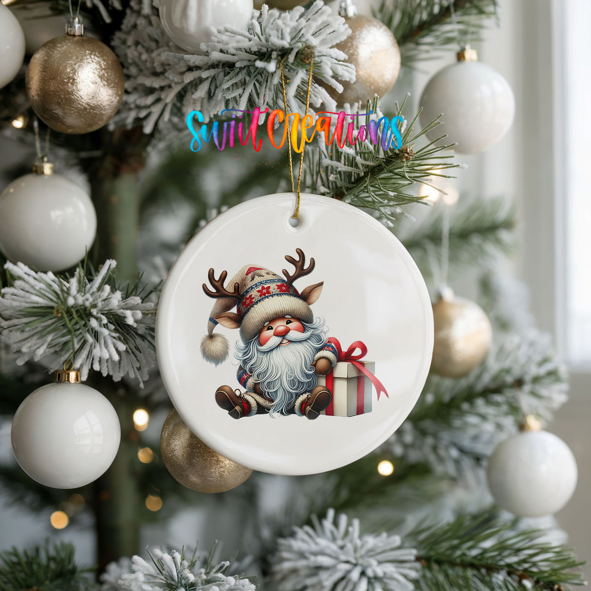 Santa sitting beside a wrapped Christmas gift ceramic Christmas ornament hanging on a frosted holiday tree