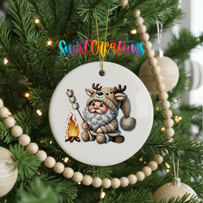 Santa roasting a marshmallow by a campfire ceramic Christmas ornament hanging on a decorated Christmas tree