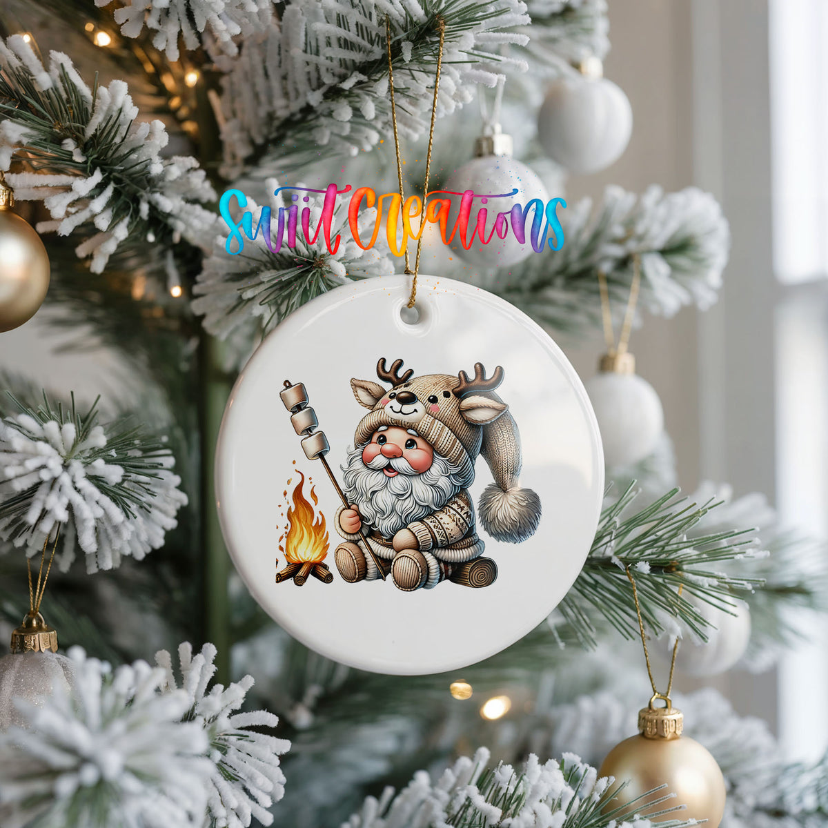 Santa roasting a marshmallow by a campfire ceramic Christmas ornament hanging on a frosted Christmas tree
