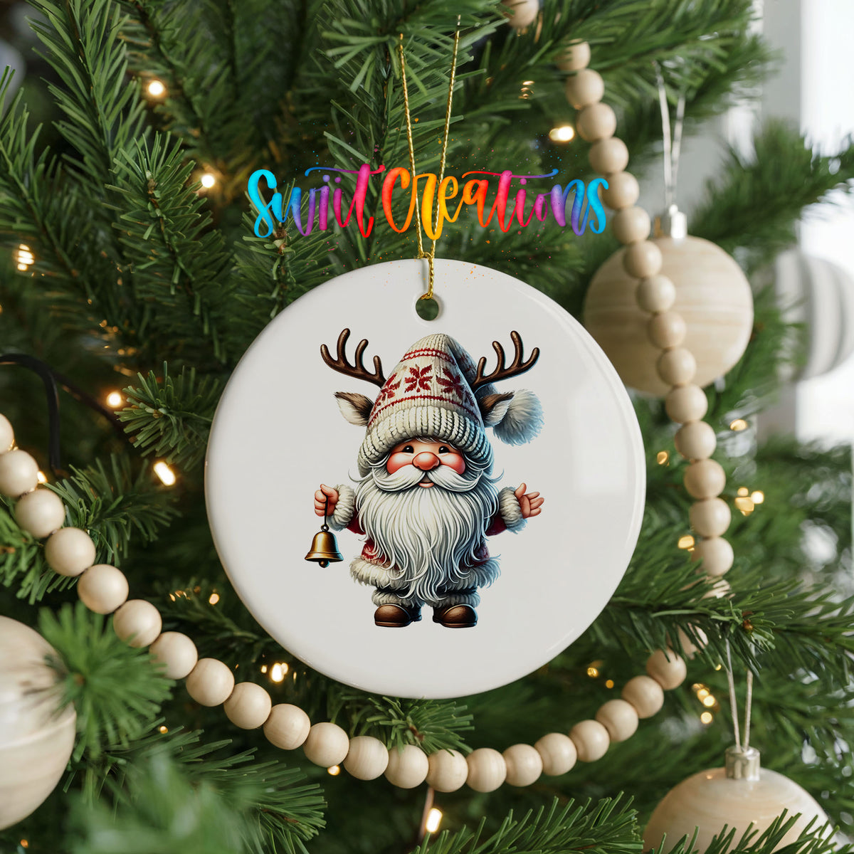 Round ceramic Christmas ornament featuring Santa ringing a Christmas handbell, hanging on a decorated Christmas tree