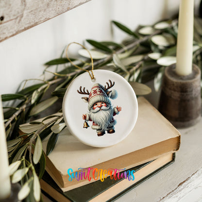 Round ceramic Christmas ornament featuring Santa ringing a Christmas handbell, styled on books with holiday greenery