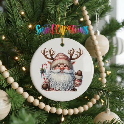 Round ceramic Christmas ornament featuring Santa holding a candy cane and mug of cocoa, hanging on a decorated Christmas tree