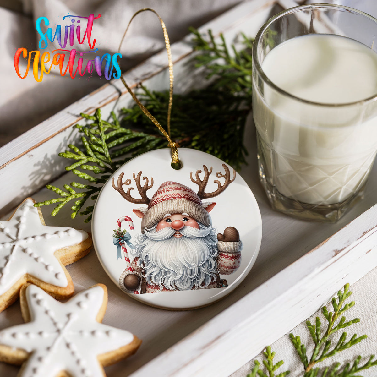 Round ceramic Christmas ornament featuring Santa holding a candy cane and mug of cocoa, styled with cookies and milk