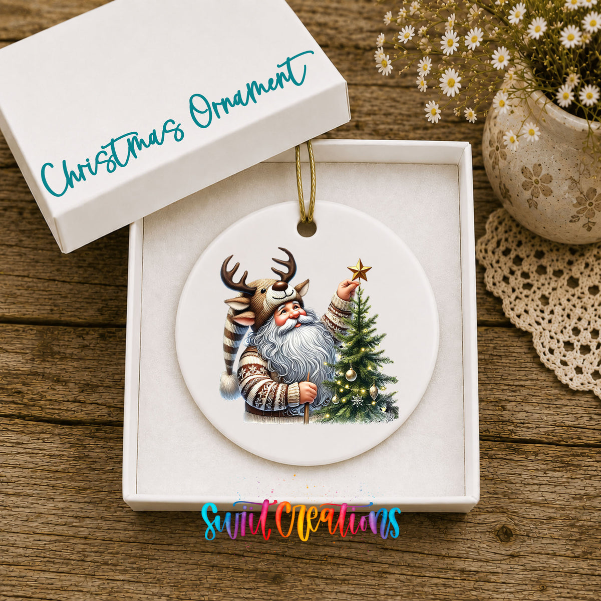 Round ceramic Christmas ornament featuring Santa placing a star on a Christmas tree, displayed in the included gift box