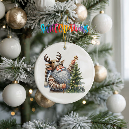 Round ceramic Christmas ornament featuring Santa placing a star on a Christmas tree, hanging on a frosted holiday tree