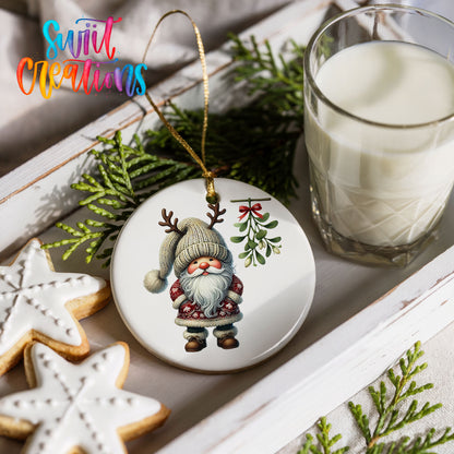 Round ceramic Christmas ornament featuring Santa standing beneath Christmas mistletoe, styled with cookies and milk
