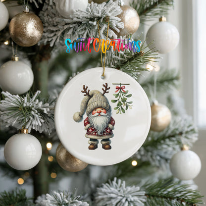 Round ceramic Christmas ornament featuring Santa standing beneath Christmas mistletoe, hanging on a frosted holiday tree