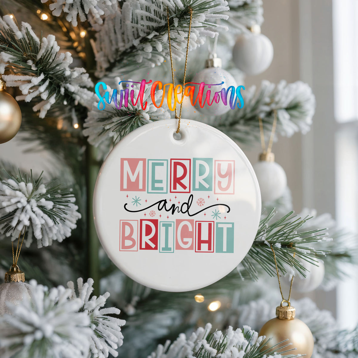 Round ceramic Christmas ornament featuring pastel block-letter Merry and Bright holiday typography, hanging on a frosted Christmas tree