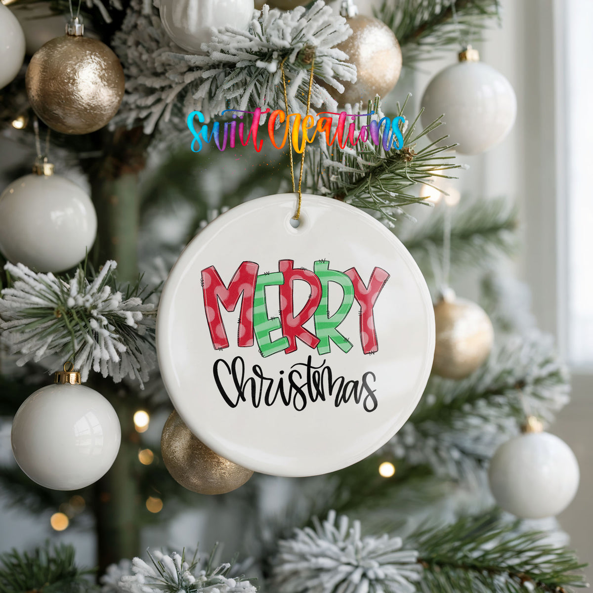Round ceramic Christmas ornament featuring colorful patterned Merry Christmas typography, hanging on a frosted holiday tree