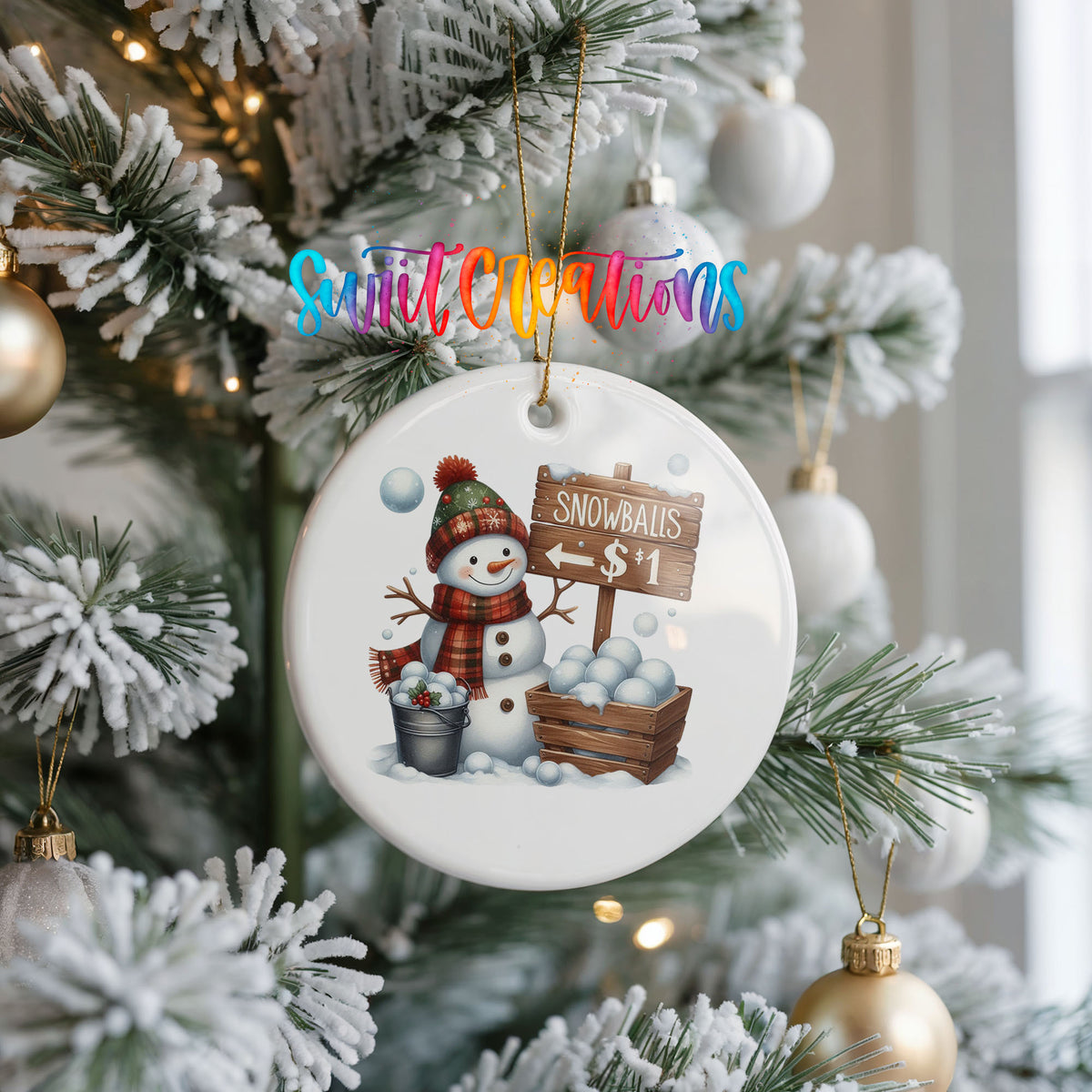 Round ceramic Christmas ornament featuring cheerful snowman selling snowballs for five cents, hanging on a frosted Christmas tree