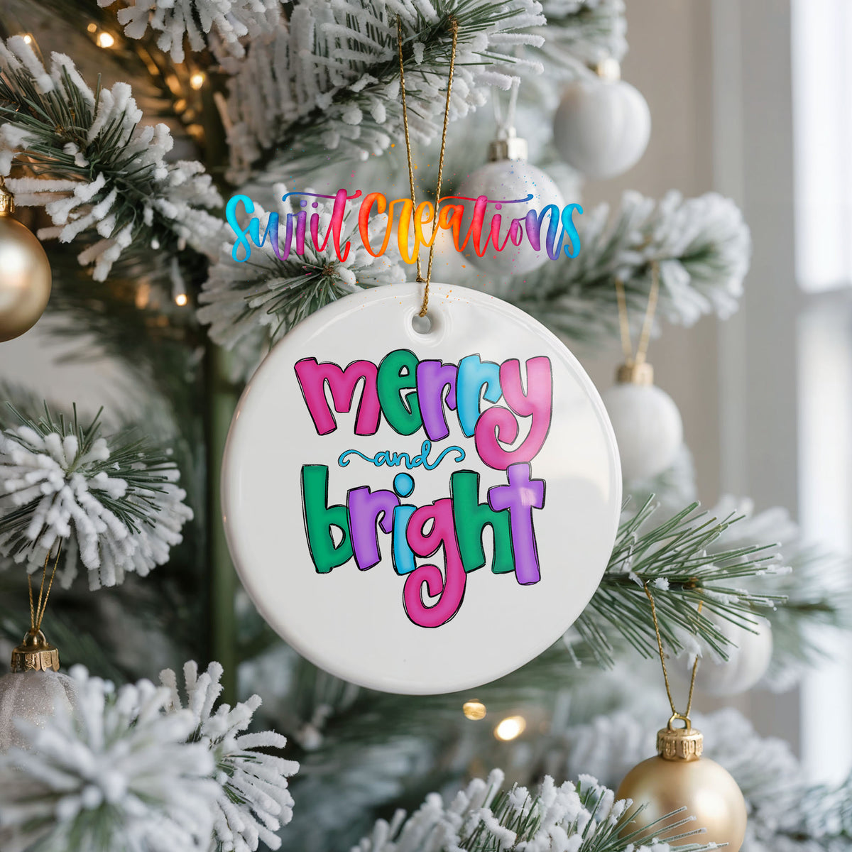 Round ceramic Christmas ornament featuring bright groovy Merry and Bright lettering in pink teal and purple, hanging on a frosted Christmas tree