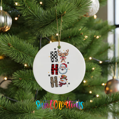 Round ceramic Christmas ornament featuring stacked Ho Ho Ho lettering with cheerful holiday characters, hanging on a green Christmas tree