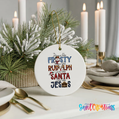 Round ceramic Christmas ornament featuring Dance like Frosty ride like Rudolph give like Santa love like Jesus message, styled with elegant holiday table decor