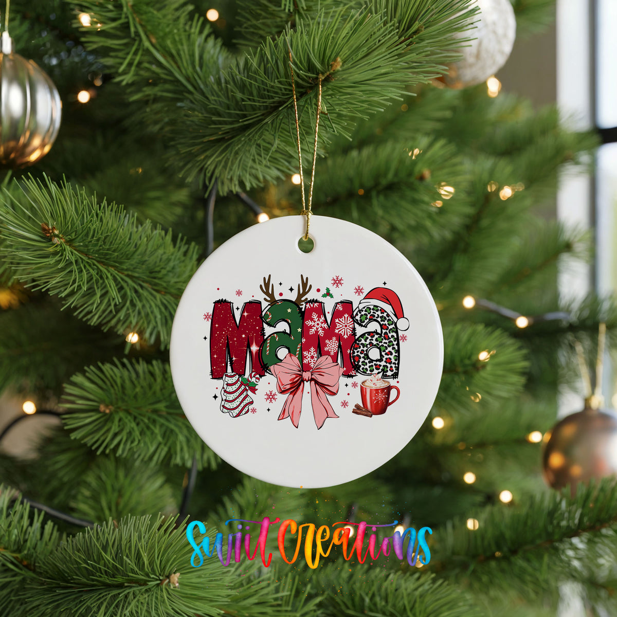 Round ceramic Christmas ornament featuring festive patterned Mama lettering with a large red holiday bow, hanging on a green Christmas tree