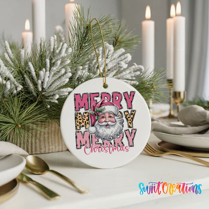 Round ceramic Christmas ornament featuring stacked Merry Merry Merry Christmas lettering with Santa and leopard print accents, styled with elegant holiday table decor