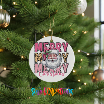 Round ceramic Christmas ornament featuring stacked Merry Merry Merry Christmas lettering with Santa and leopard print accents, hanging on a green Christmas tree