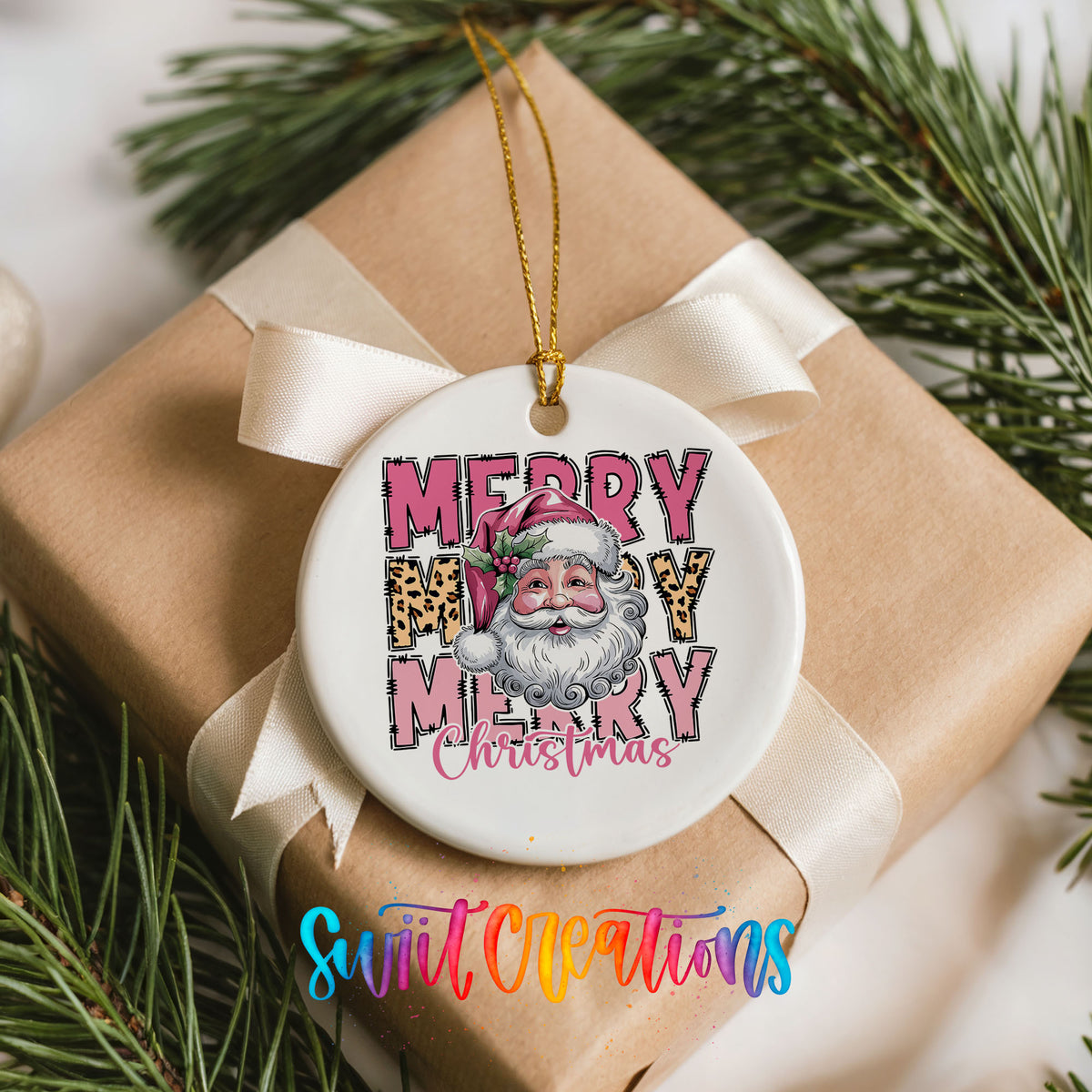 Round ceramic Christmas ornament featuring stacked Merry Merry Merry Christmas lettering with Santa and leopard print accents, placed on a wrapped Christmas gift