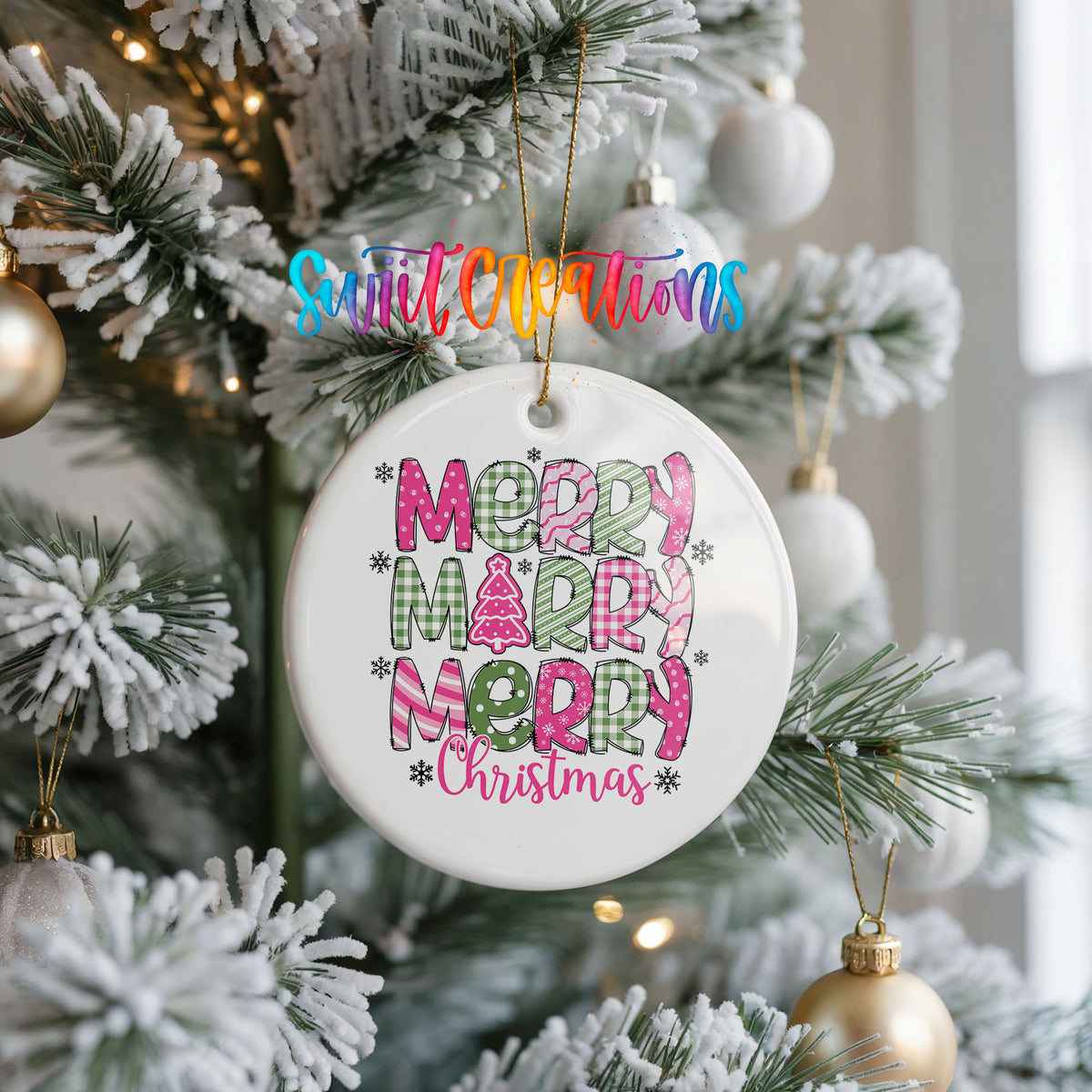 Round ceramic Christmas ornament featuring stacked patterned Merry Merry Merry Christmas lettering in pink and green, hanging on a frosted Christmas tree