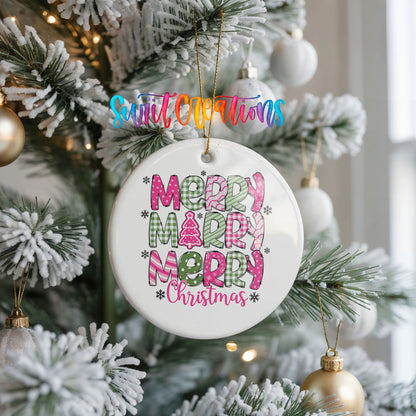Round ceramic Christmas ornament featuring stacked patterned Merry Merry Merry Christmas lettering in pink and green, hanging on a frosted Christmas tree