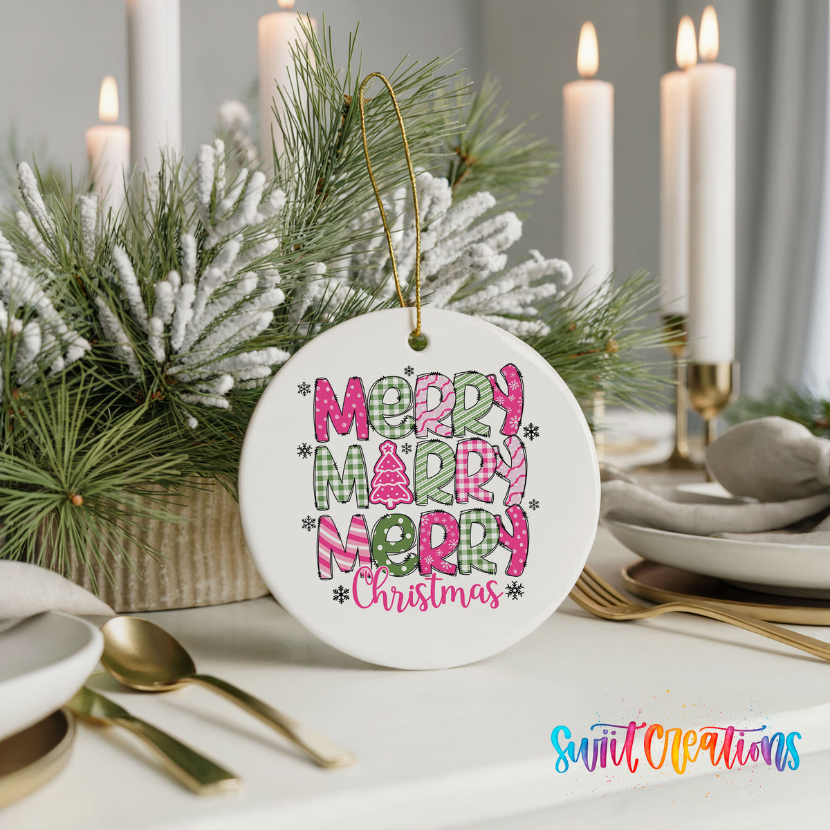 Round ceramic Christmas ornament featuring stacked patterned Merry Merry Merry Christmas lettering in pink and green, styled with elegant holiday table decor