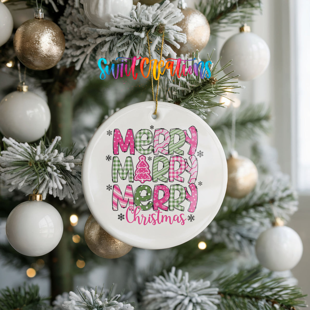 Round ceramic Christmas ornament featuring stacked patterned Merry Merry Merry Christmas lettering in pink and green, hanging on a frosted holiday tree