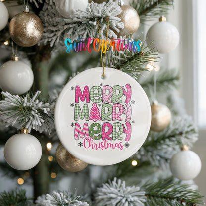 Round ceramic Christmas ornament featuring stacked patterned Merry Merry Merry Christmas lettering in pink and green, hanging on a frosted holiday tree