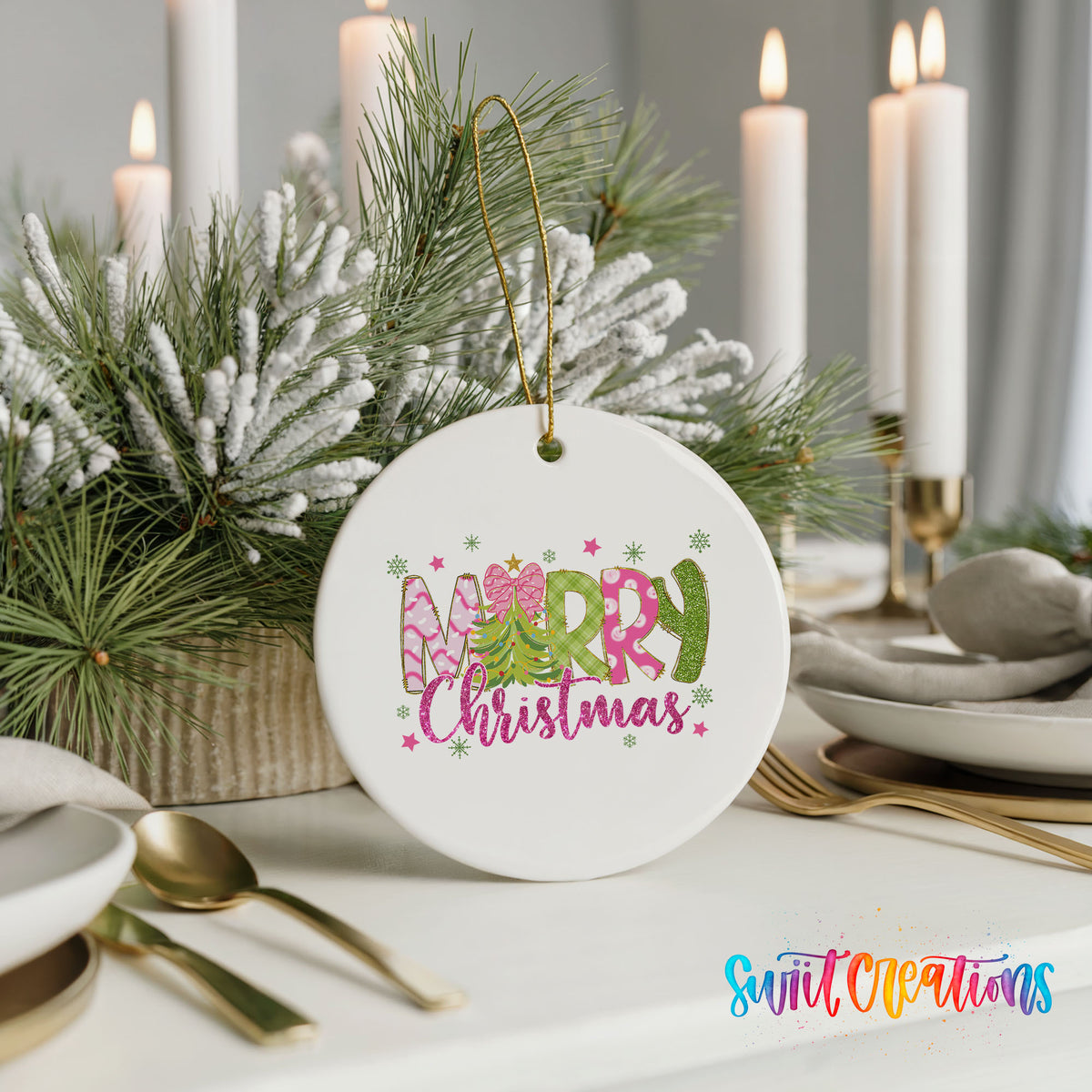 Round ceramic Christmas ornament featuring bright Merry Christmas lettering with candy stripe and floral details, styled with elegant holiday table decor