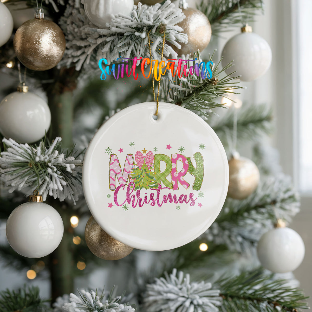 Round ceramic Christmas ornament featuring bright Merry Christmas lettering with candy stripe and floral details, hanging on a frosted holiday tree