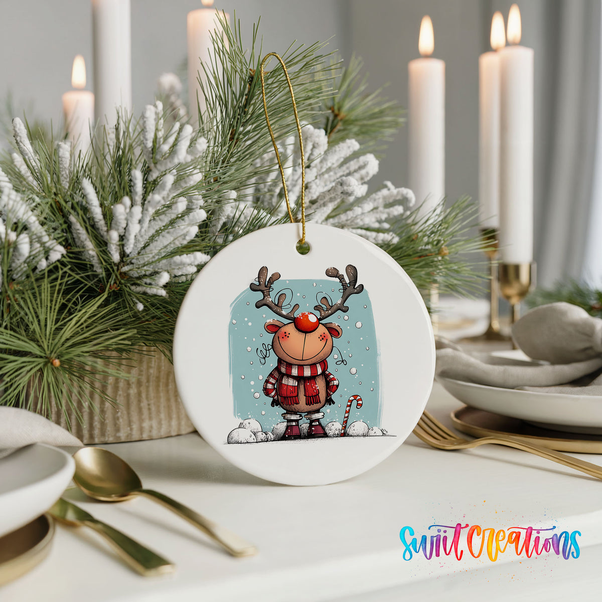 Round ceramic Christmas ornament featuring smiling reindeer in red plaid winter clothes against a snowy blue background, styled with elegant holiday table decor