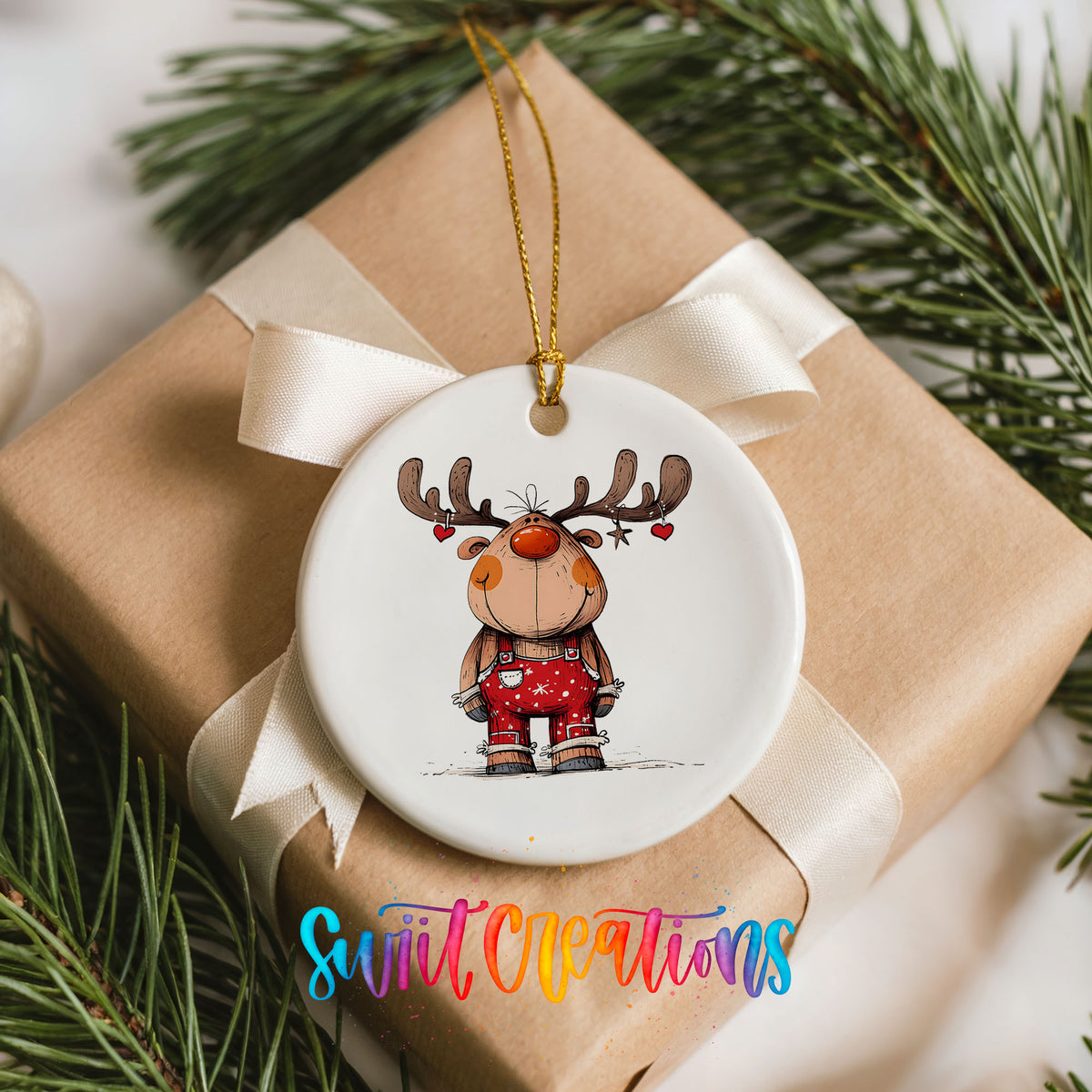 Reindeer in Red Plaid Sweater Christmas ornament placed on a wrapped Christmas gift