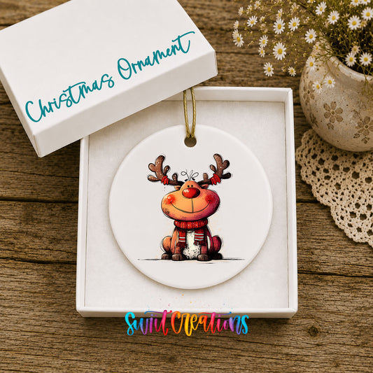 Jolly Reindeer in Red and Black Outfit Christmas ornament displayed in an included gift box