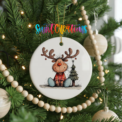 Sitting Reindeer with Gift and Christmas Tree Christmas ornament hanging on a decorated Christmas tree