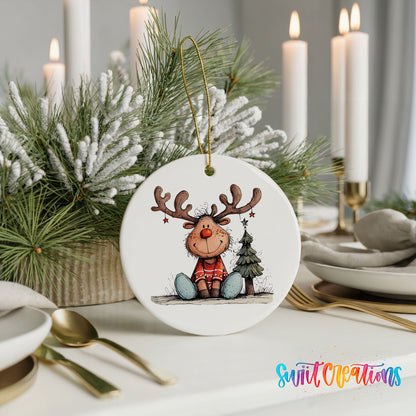 Sitting Reindeer with Gift and Christmas Tree Christmas ornament styled with elegant holiday table decor