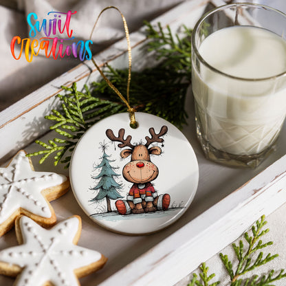 Sitting Reindeer with Pine Trees and Gift Christmas ornament styled with cookies and milk