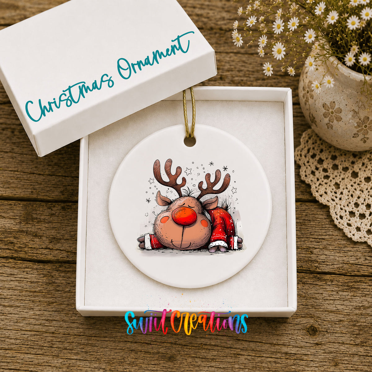 Sleeping Reindeer in Red Scarf Christmas ornament displayed in an included gift box