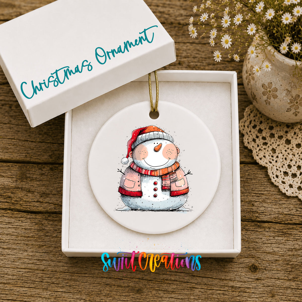 Snowman Couple in Red Santa Hats Christmas ornament displayed in an included gift box