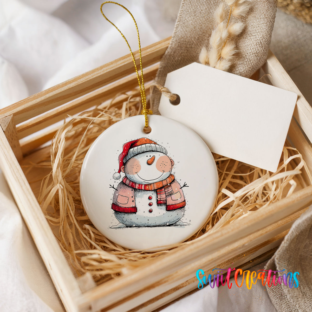 Snowman Couple in Red Santa Hats Christmas ornament presented in a rustic wooden gift crate