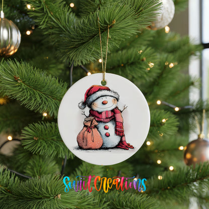 Snowman with Pink Gift Sack Christmas ornament hanging on a green Christmas tree