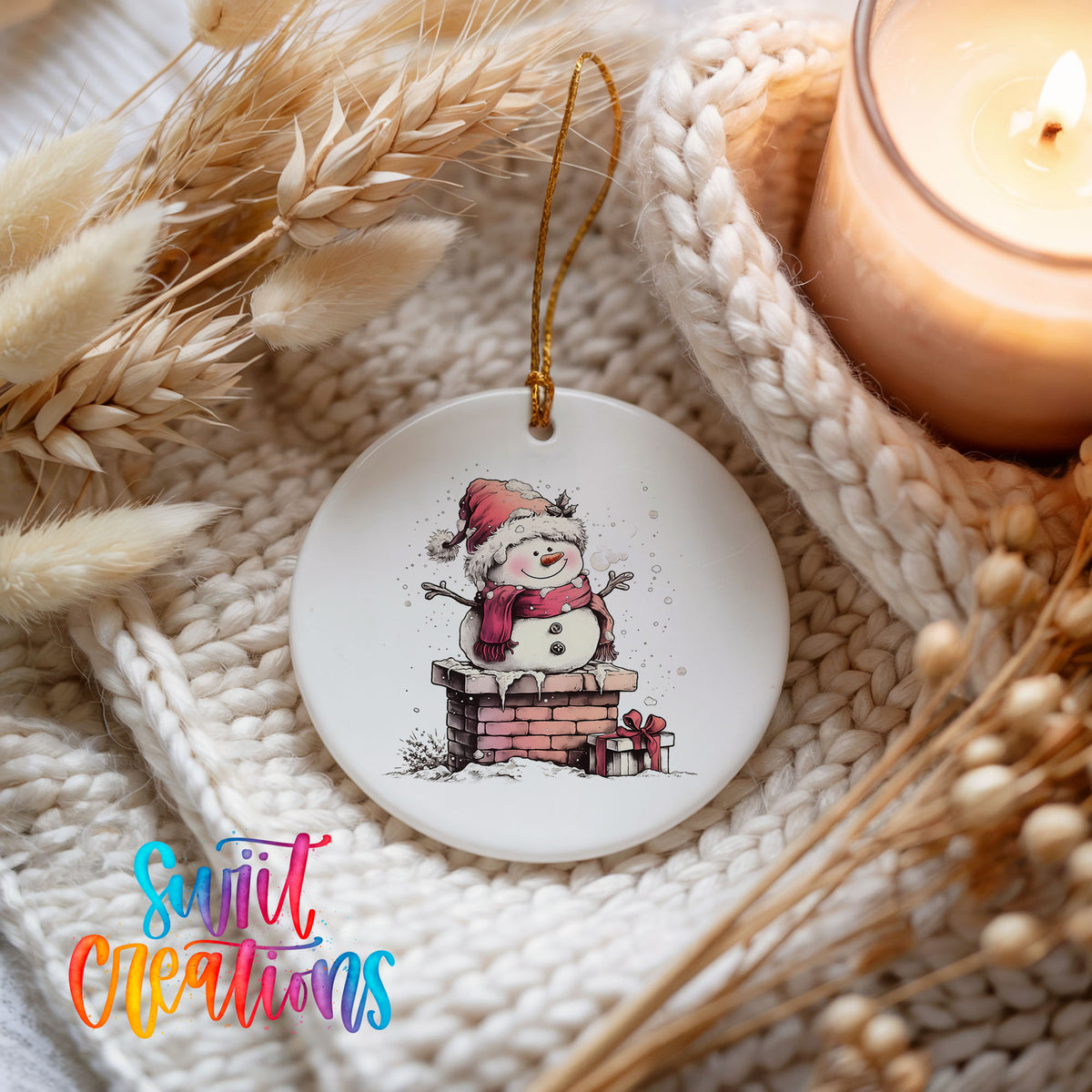 Snowman Beside a Holiday Mailbox Christmas ornament styled beside a candle and cozy knit blanket