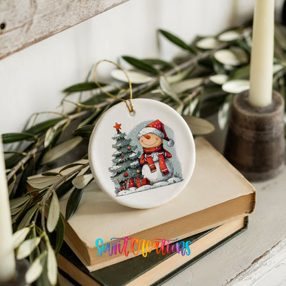 Santa Decorating a Christmas Tree Christmas ornament styled on books with holiday greenery