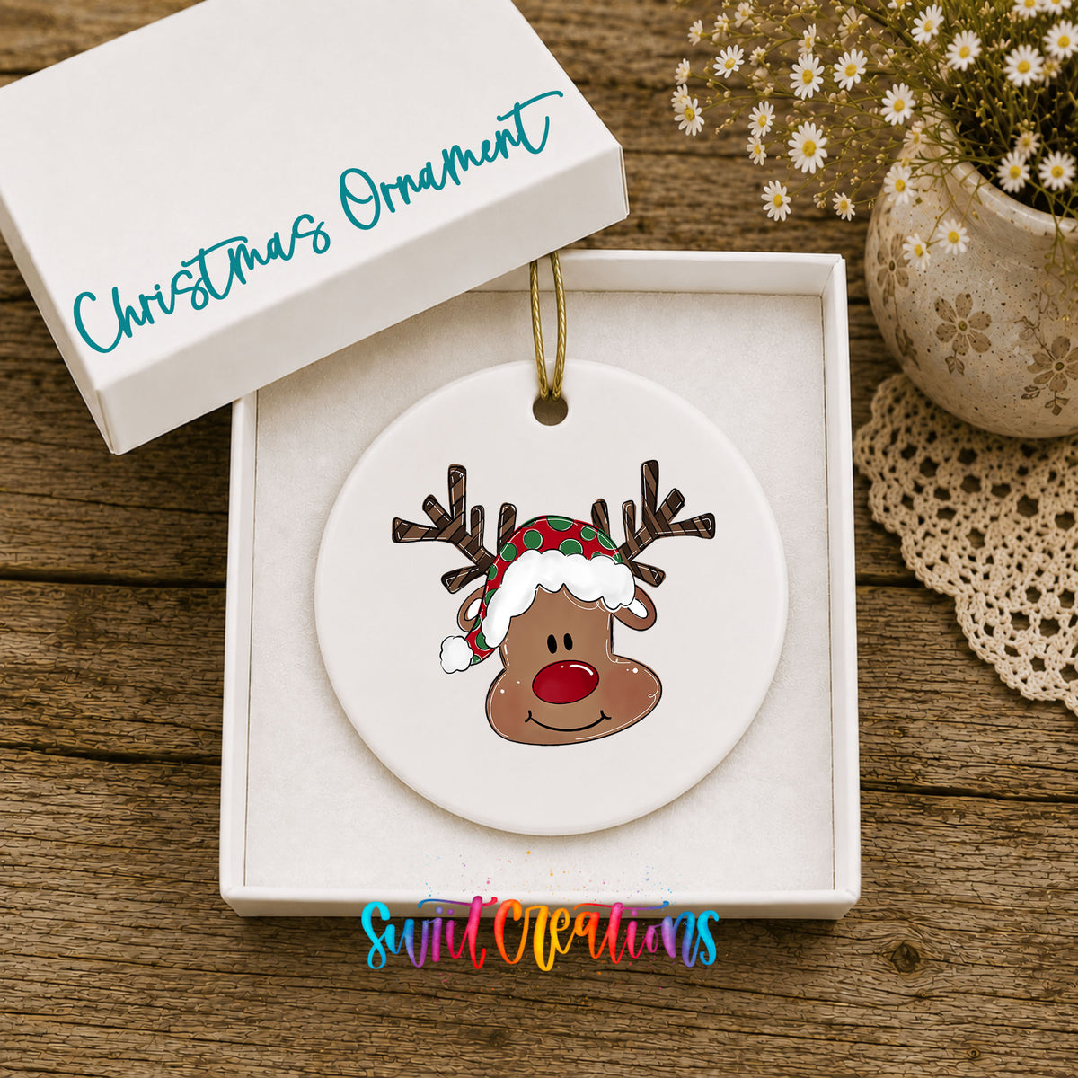 Cute Reindeer Face ceramic Christmas ornament displayed in gift box