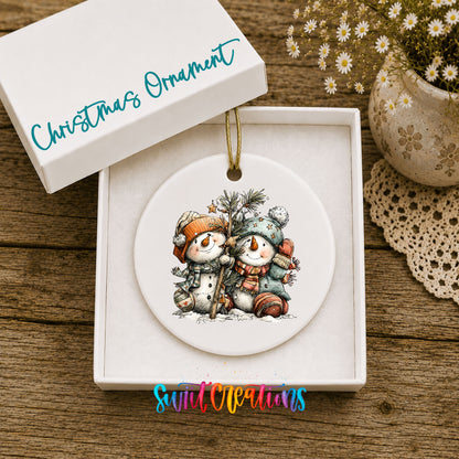 Snowman Friends with Pine Tree and Gifts ceramic Christmas ornament displayed in gift box