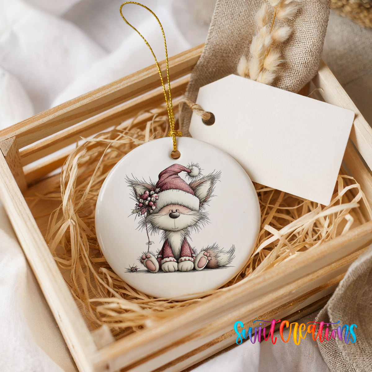 pink fox in a Santa hat ceramic Christmas ornament displayed in a wooden gift crate