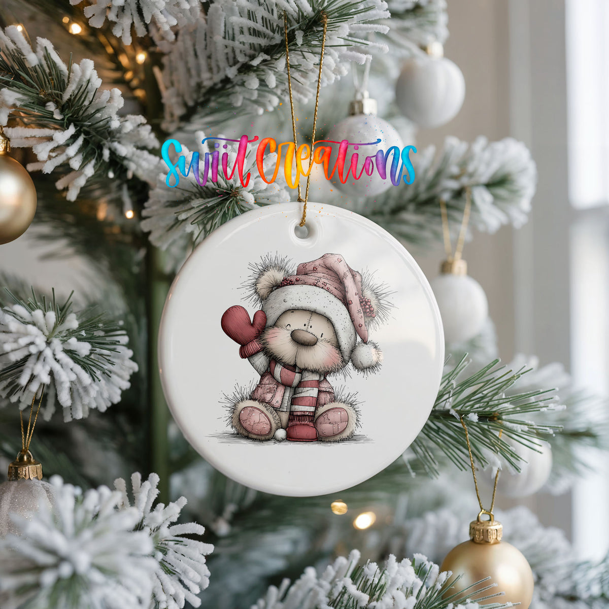 teddy bear holding a pink heart in a Santa hat ceramic Christmas ornament hanging on a frosted Christmas tree
