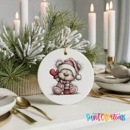 teddy bear holding a pink heart in a Santa hat ceramic Christmas ornament shown in a holiday table setting