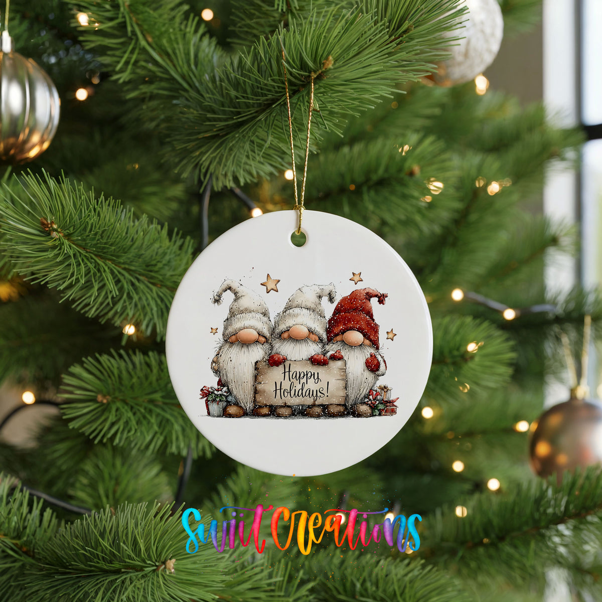 whimsical Christmas characters with a Happy Holidays message ceramic Christmas ornament hanging on a lit Christmas tree