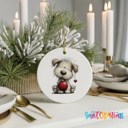 fluffy Christmas puppy holding a red ornament ceramic Christmas ornament shown in a holiday table setting